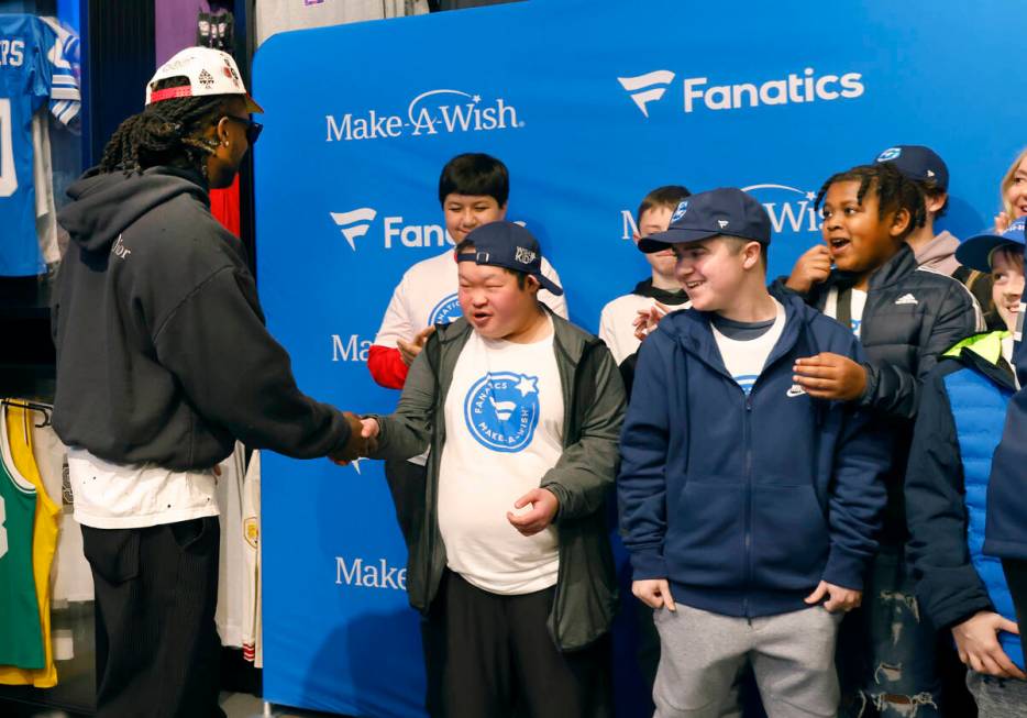 Make-A-Wish kids react as Raiders wide receiver Davante Adams arrives at the Lids Flagship Stor ...