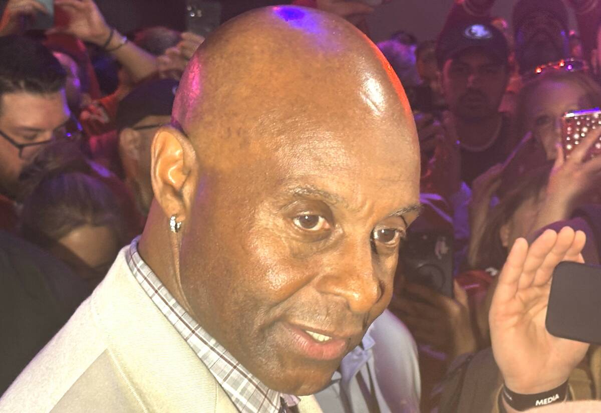 San Francisco 49ers legend Jerry Rice speaks to reporters at the Super Bowl Experience at the M ...