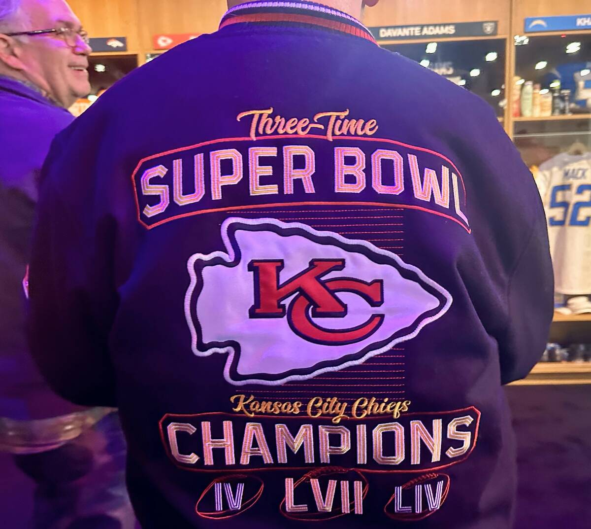Las Vegas resident Michael Tenby wears his Kansas City Chiefs jacket at the Super Bowl Experien ...