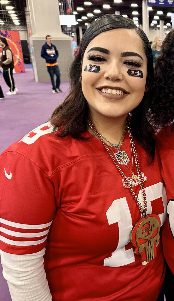 Sophia Angel, 20, of San Francisco, wears her 49ers jersey at the Super Bowl Experience at the ...