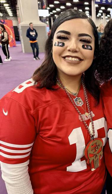 Sophia Angel, 20, of San Francisco, wears her 49ers jersey at the Super Bowl Experience at the ...