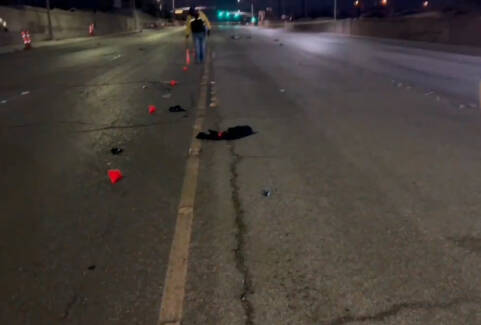 Police investigate a fatal hit-and-run Friday, Feb. 9, 2024, on West Lake Mead Boulevard near L ...