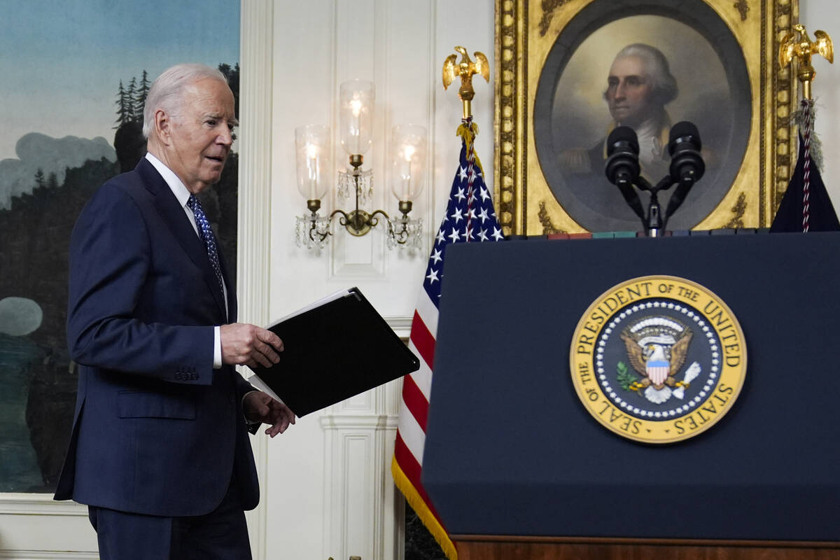 President Joe Biden arrives to speak in the Diplomatic Reception Room of the White House, Thurs ...