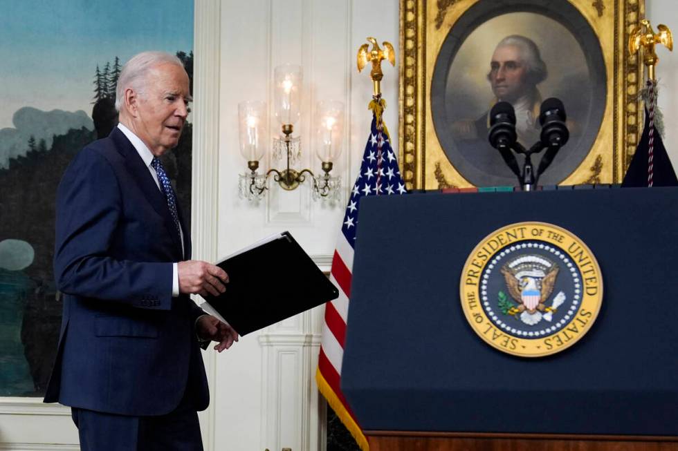 President Joe Biden arrives to speak in the Diplomatic Reception Room of the White House, Thurs ...