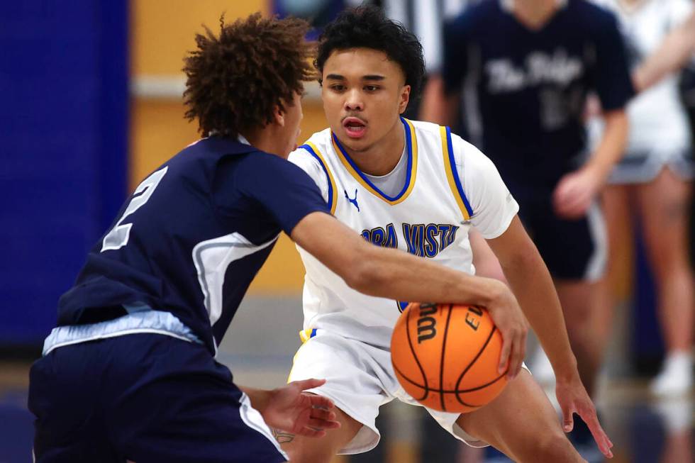 Sierra Vista guard Ej Dacuma (0) defends against Shadow Ridge guard Jesse Judkins (2) during a ...