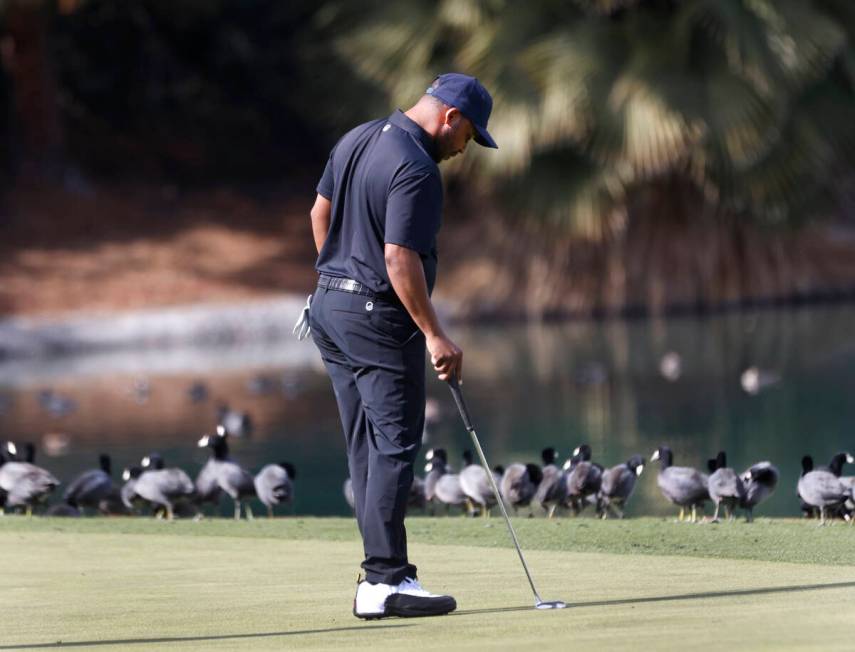 Harold Varner III of team 4Aces GC surveys the green on the 9th hole during the second round of ...