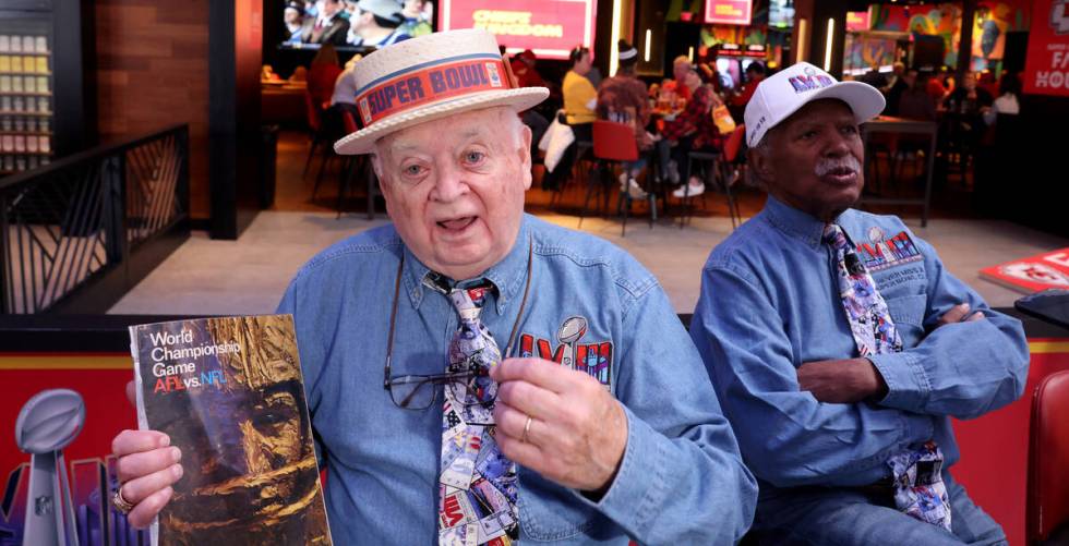 Don Crisman, 87, a member of the Never Miss a Super Bowl Club, shows a program from the first S ...