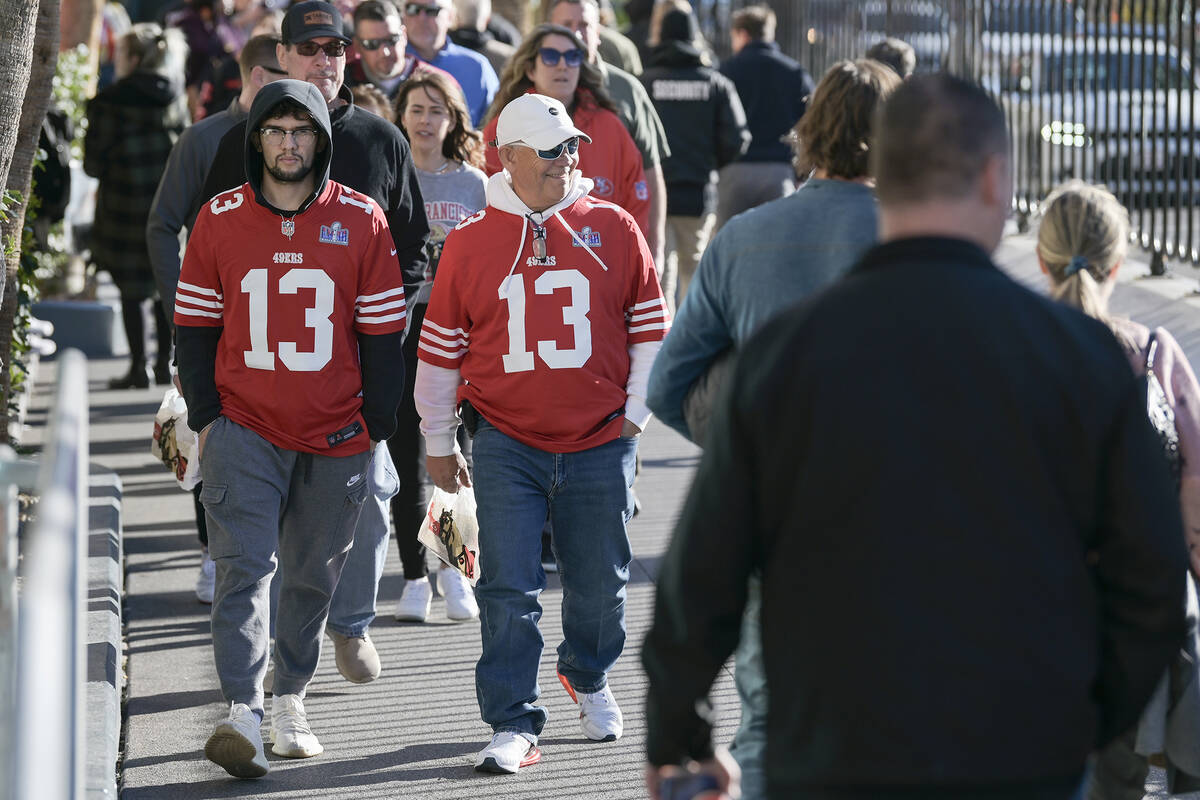 San Francisco 49ers fans walk up the Strip the day before Super Bowl LVIII Saturday, February 1 ...