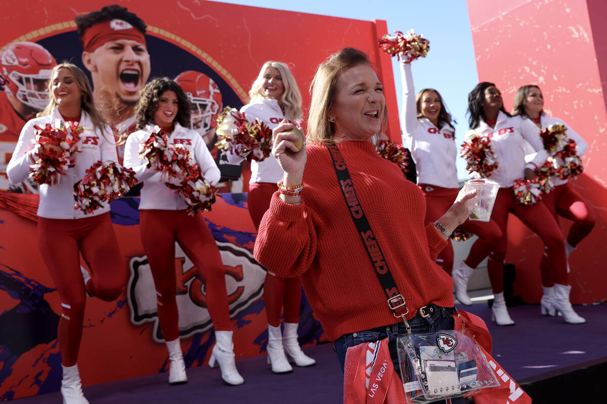 Kansas City Chiefs fan Diane Beaman, of Missouri, dances to a Taylor Swift song in front of the ...