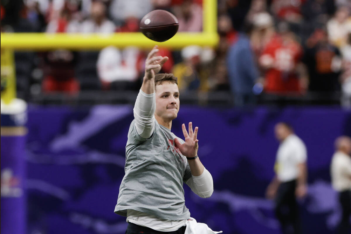 San Francisco 49ers quarterback Brock Purdy (13) warms up for Super Bowl 58 at Allegiant Stadiu ...