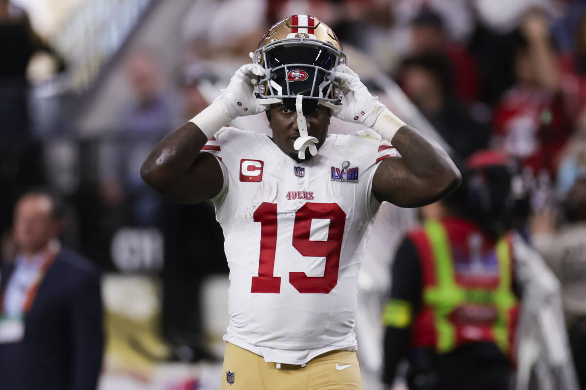 San Francisco 49ers wide receiver Deebo Samuel (19) puts his helmet back on during the first ha ...