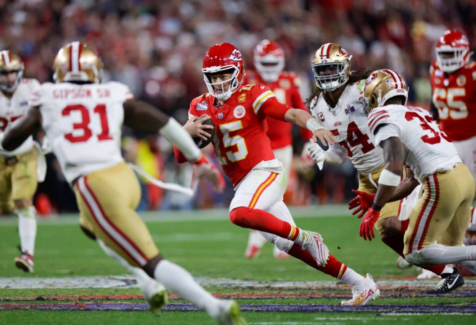 Kansas City Chiefs quarterback Patrick Mahomes (15) runs the ball against San Francisco 49ers d ...
