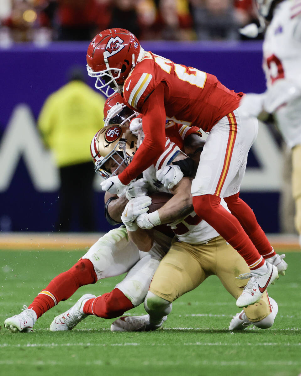 San Francisco 49ers running back Christian McCaffrey (23) is taken down by the Kansas City Chie ...