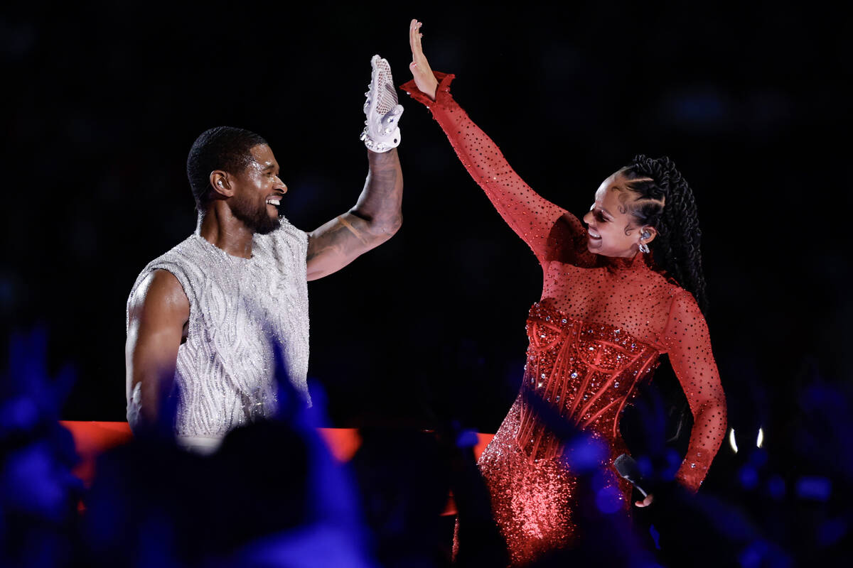Usher and Alicia Keys perform during halftime of Super Bowl 58 Sunday, February 11, 2024, at A ...