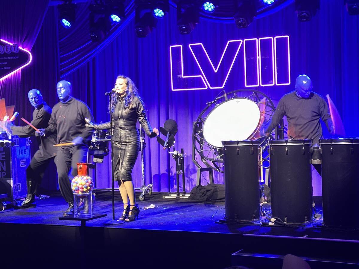 Blue Man Group and Vegas singer Carol-Lyn Liddle perform at the Super Bowl weekend Commissioner ...