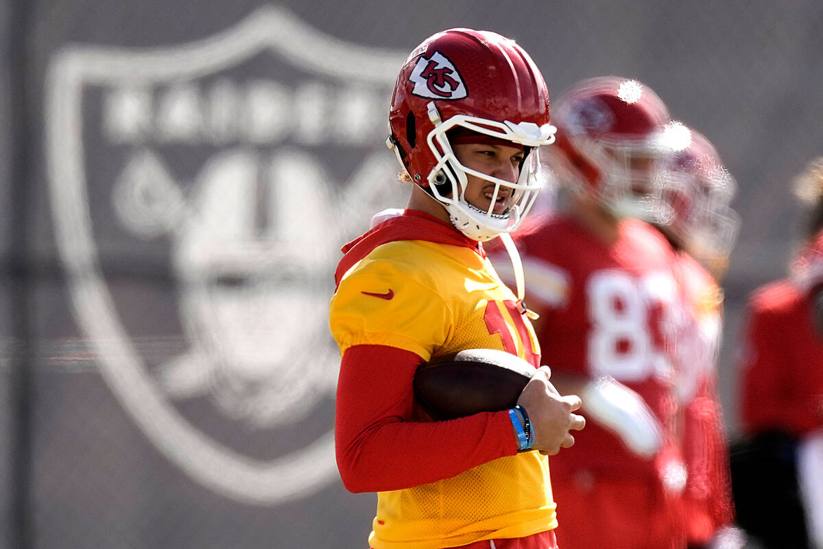 Kansas City Chiefs quarterback Patrick Mahomes watches practice for Super Bowl 58 Friday, Feb. ...