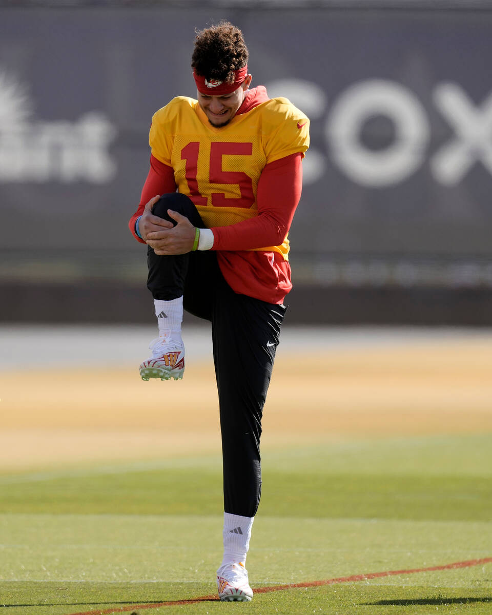 Kansas City Chiefs quarterback Patrick Mahomes stretches during practice Wednesday, Feb. 7, 202 ...