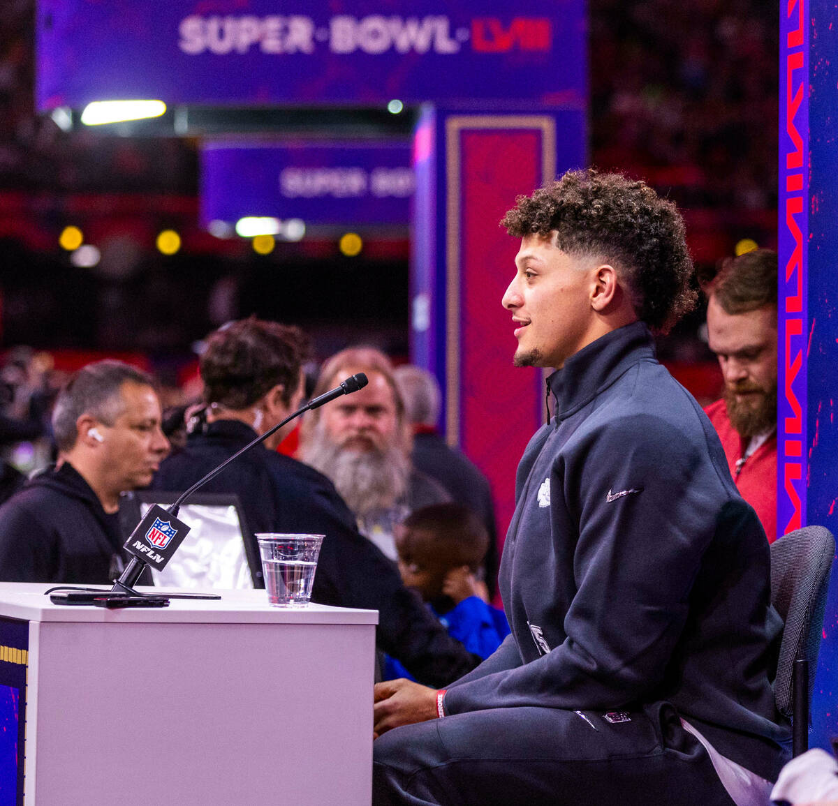 Kansas City Chiefs player Patrick Mahomes listens to a media member's question on the field dur ...