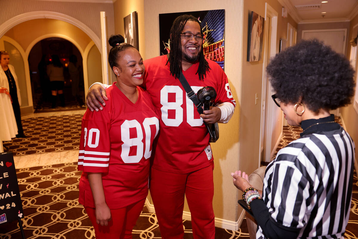 Nicole and Kevin Crockrom of Las Vegas visit with marriage officiant Wanda Tracey before renewi ...