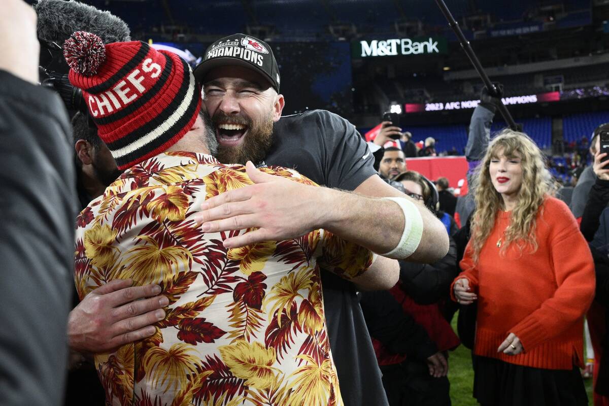 Jason Kelce embraces his brother Kansas City Chiefs tight end Travis Kelce after the AFC Champi ...