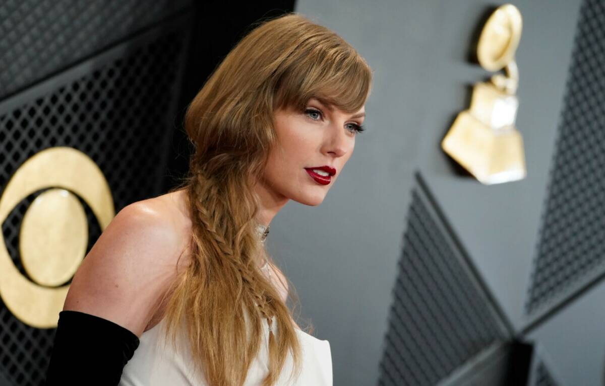 Taylor Swift arrives at the 66th annual Grammy Awards on Sunday, Feb. 4, 2024, in Los Angeles. ...