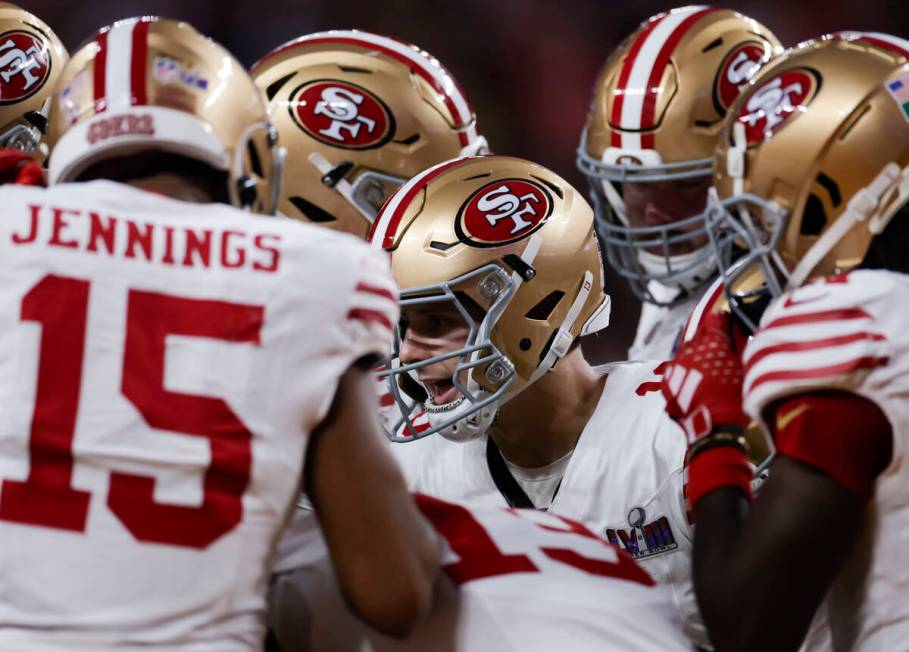 San Francisco 49ers quarterback Brock Purdy huddles with teammates during the first half of Sup ...