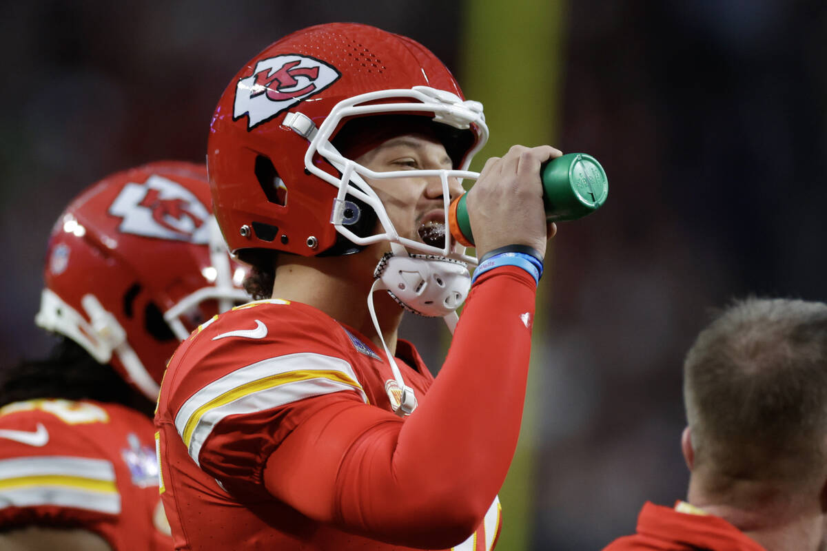 Kansas City Chiefs quarterback Patrick Mahomes (15) takes a drink during Super Bowl 58 against ...