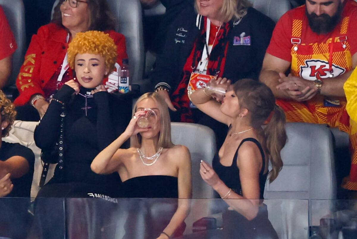Taylor Swift downs a drink during Super Bowl 58 between the Kansas City Chiefs and the San Fran ...