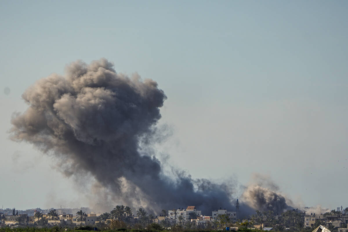 Smoke and explosion following an Israeli bombardment inside the Gaza Strip, as seen from southe ...