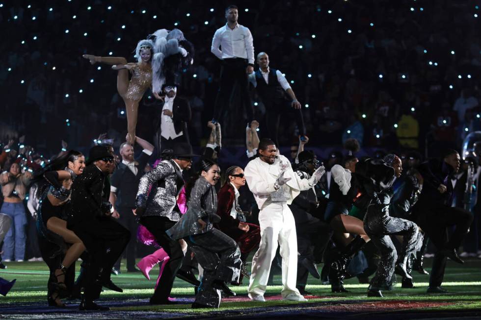 Usher performs during halftime of Super Bowl 58 Sunday, February 11, 2024, at Allegiant Stadiu ...