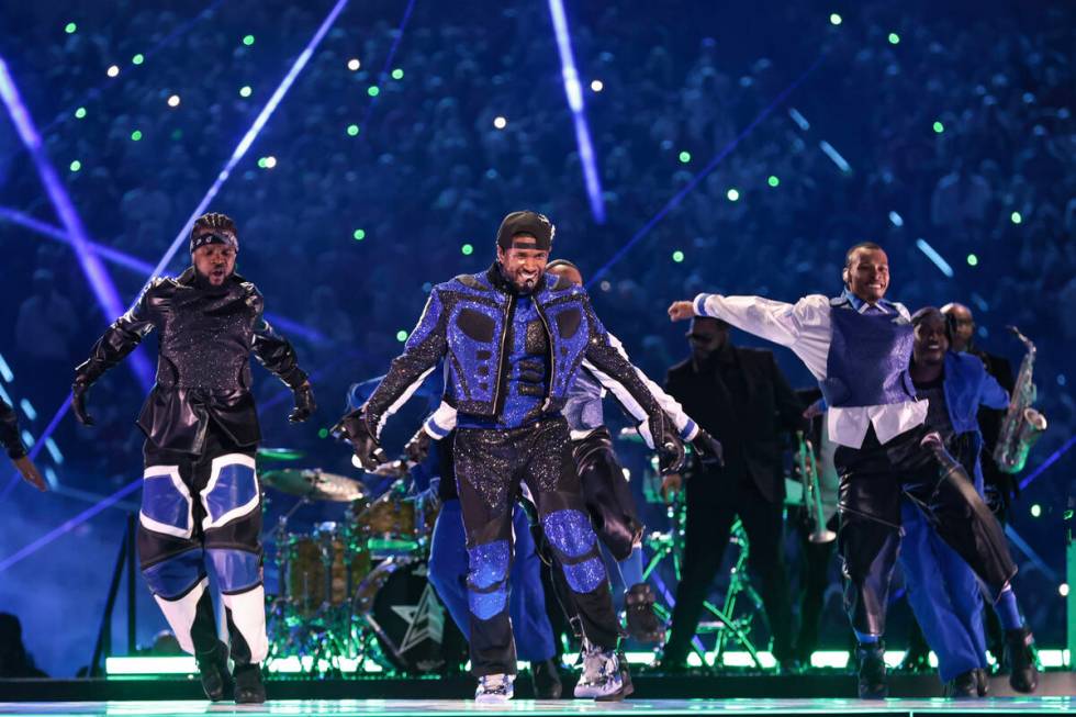 Usher performs during halftime of Super Bowl 58 Sunday, February 11, 2024, at Allegiant Stadiu ...