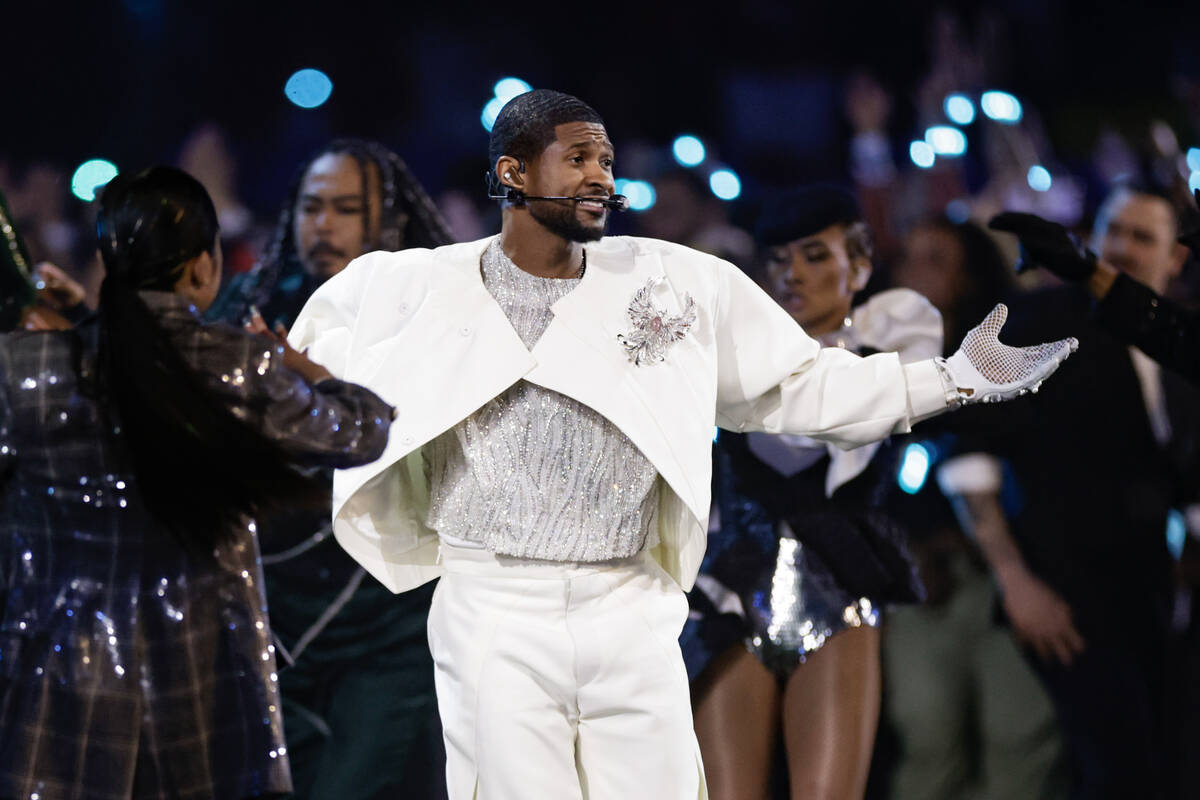 Usher performs during halftime of Super Bowl 58 Sunday, February 11, 2024, at Allegiant Stadiu ...