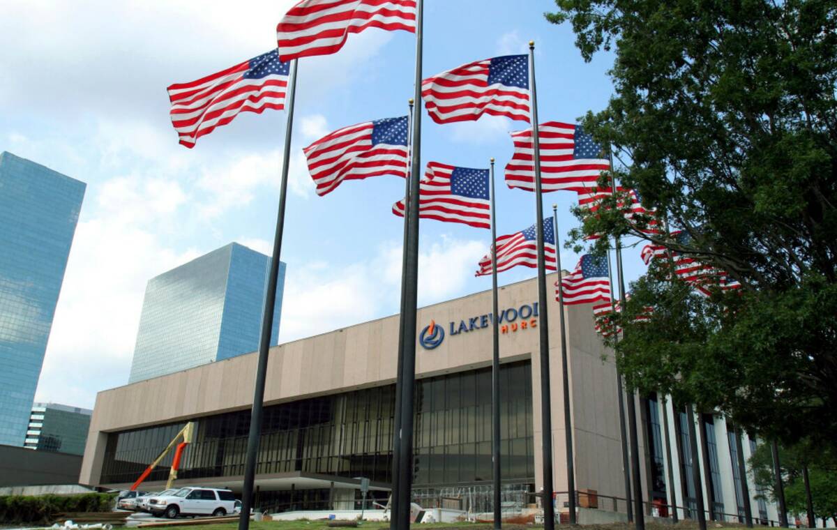 Flags fly in front of the Lakewood Church in Houston in 2005. (AP Photo/Pat Sullivan)