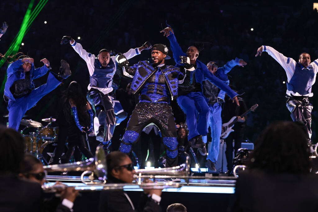 Usher performs during halftime of Super Bowl 58 Sunday, February 11, 2024, at Allegiant Stadiu ...