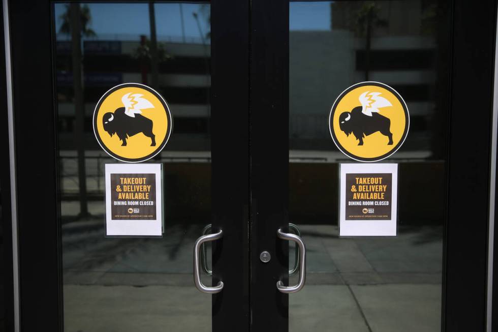 A sign for the open Buffalo Wild Wings in the Miracle Mile Shops in Las Vegas, Thursday, March ...