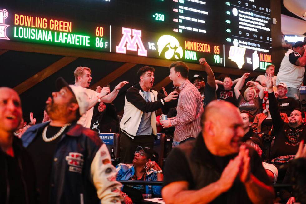 Fans react to the Kansas City Chiefs scoring a touchdown against San Francisco 49ers for Super ...