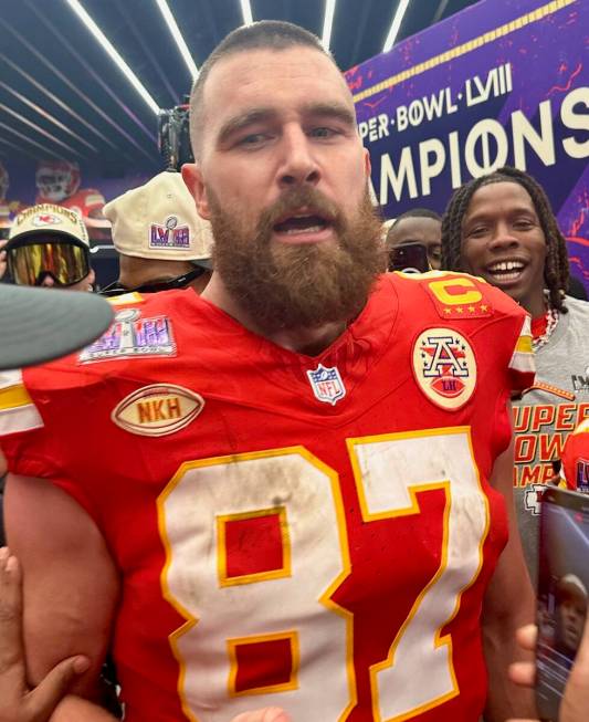 Kansas City Chiefs tight end Travis Kelce celebrates in the team's locker room at Allegiant Sta ...