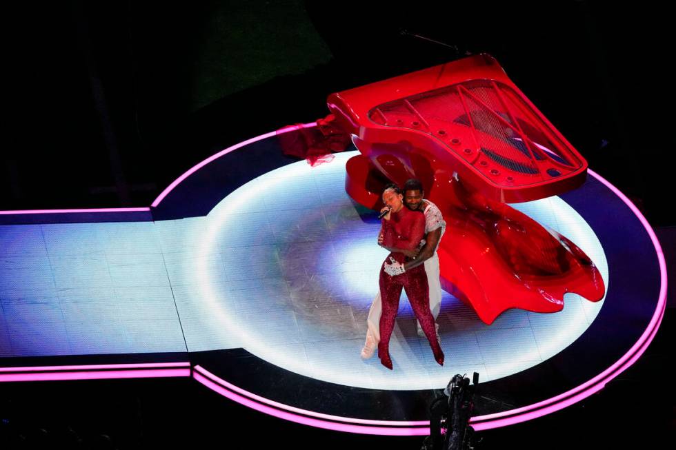Usher, right, and Alicia Keys perform during halftime of the NFL Super Bowl 58 football game be ...