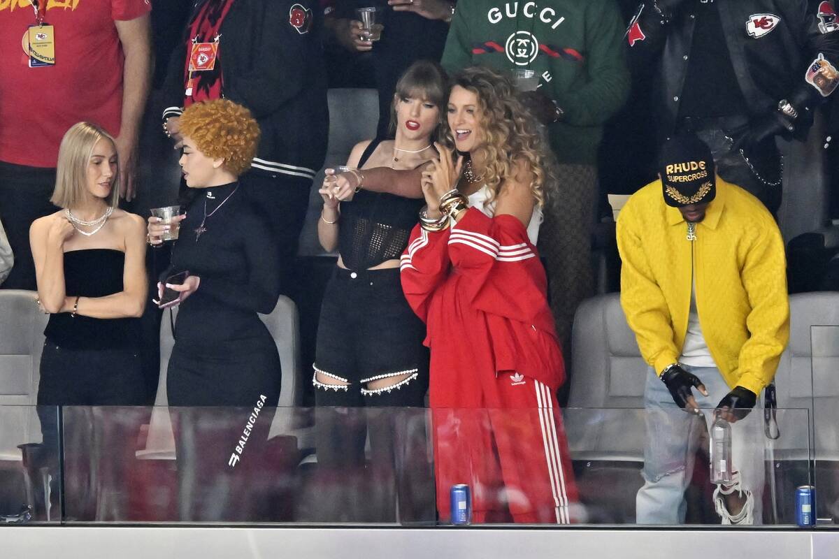 Ashley Avignone, from left, Ice Spice, Taylor Swift and Blake Lively talk before the NFL Super ...