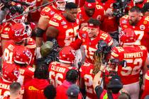 Kansas City Chiefs quarterback Patrick Mahomes (15) huddles with teammates before the start of ...