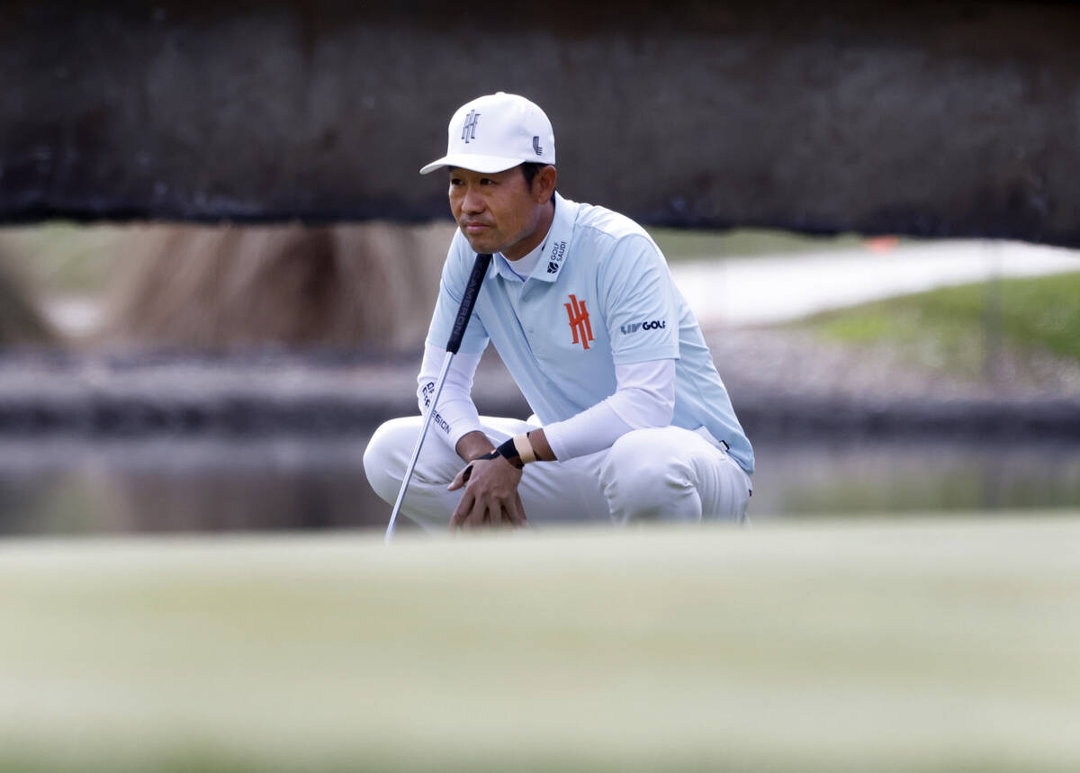 Kevin Na of team Iron Heads GC surveys the green on the 18th during the second round of LI ...