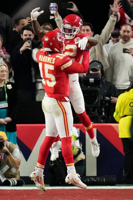 Kansas City Chiefs quarterback Patrick Mahomes (15) celebrates with wide receiver Mecole Hardma ...