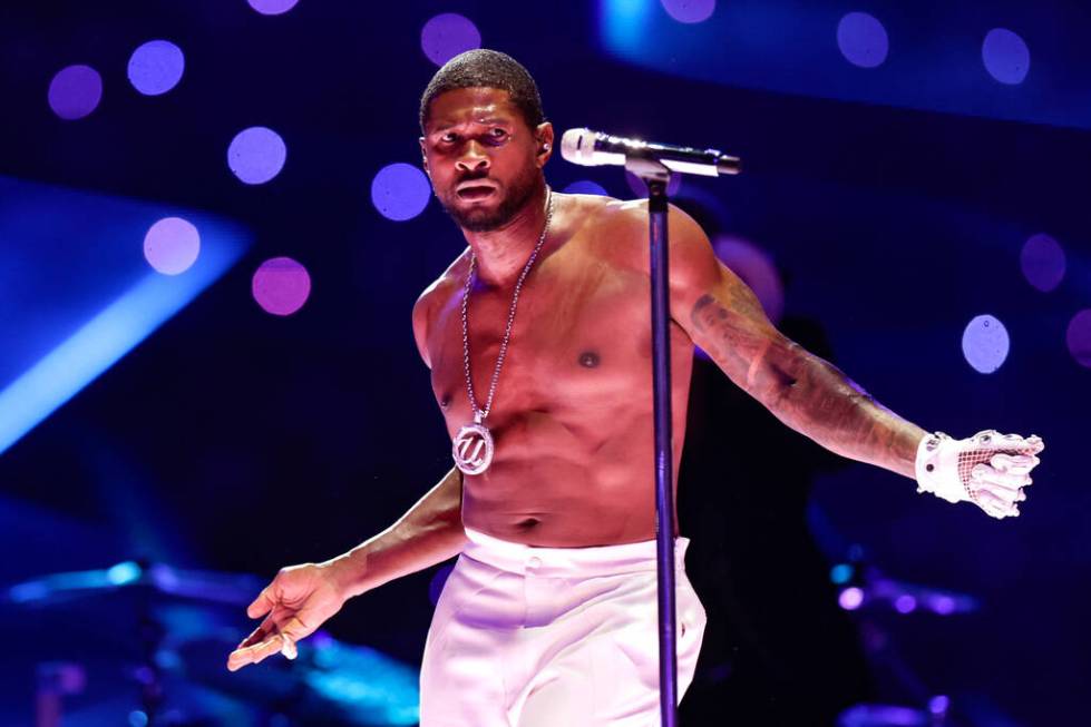 Usher performs during halftime of Super Bowl 58 Sunday, February 11, 2024, at Allegiant Stadiu ...