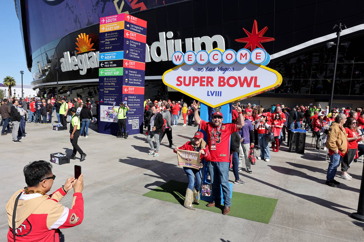 49ers fans Melyssah Morrison and Clinton Meyerhoff of Pacifica, Calif. pose outside Allegiant S ...