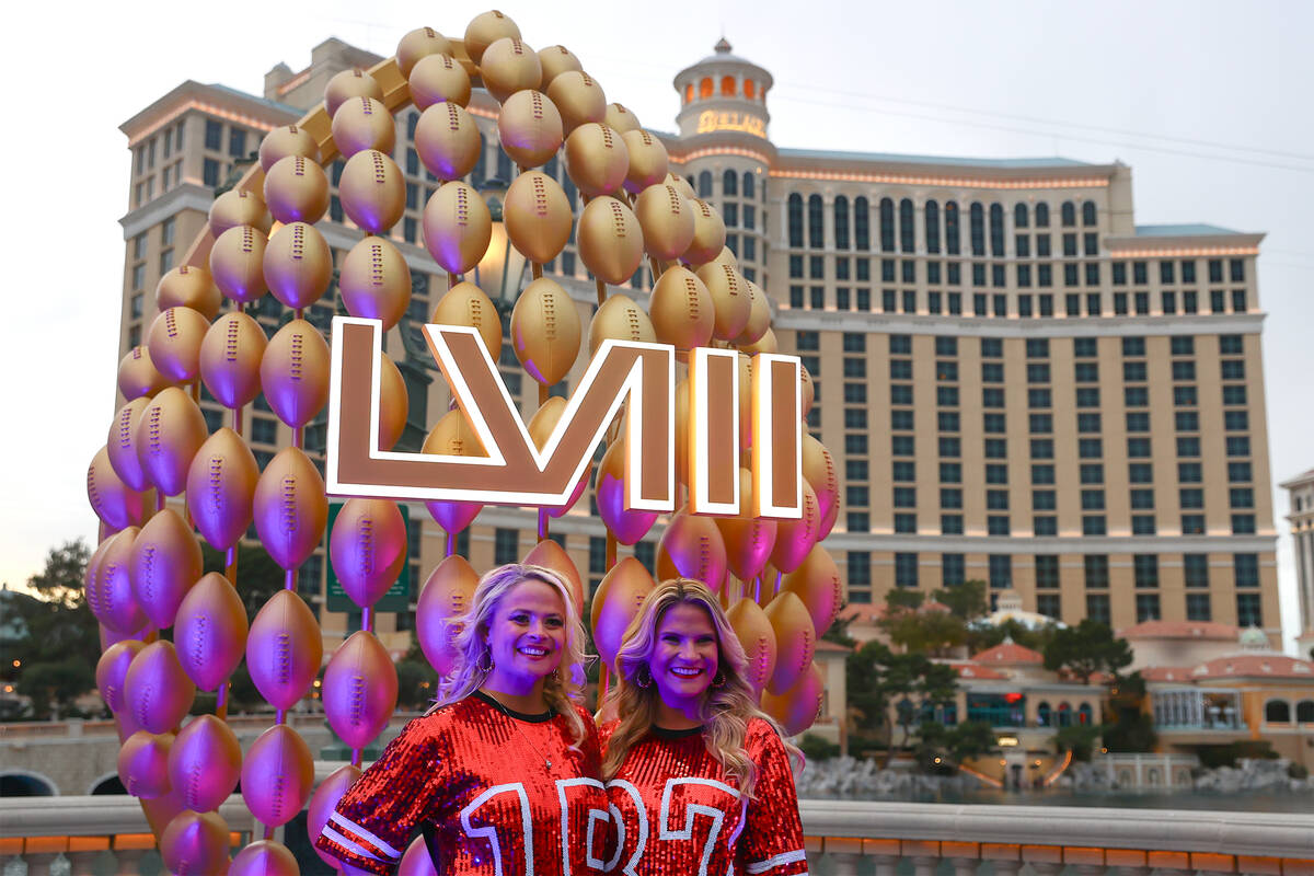 Sisters Katie Rose Hargreaves, let, and Olivia Fry, of Kansas City, poses for photos in front o ...