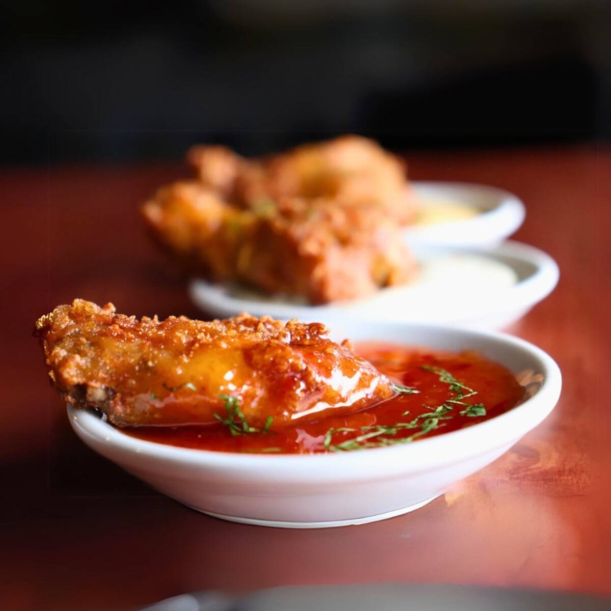 Chicken wings from the new menu launched in early 2024 at Other Mama, the popular Las Vegas sea ...