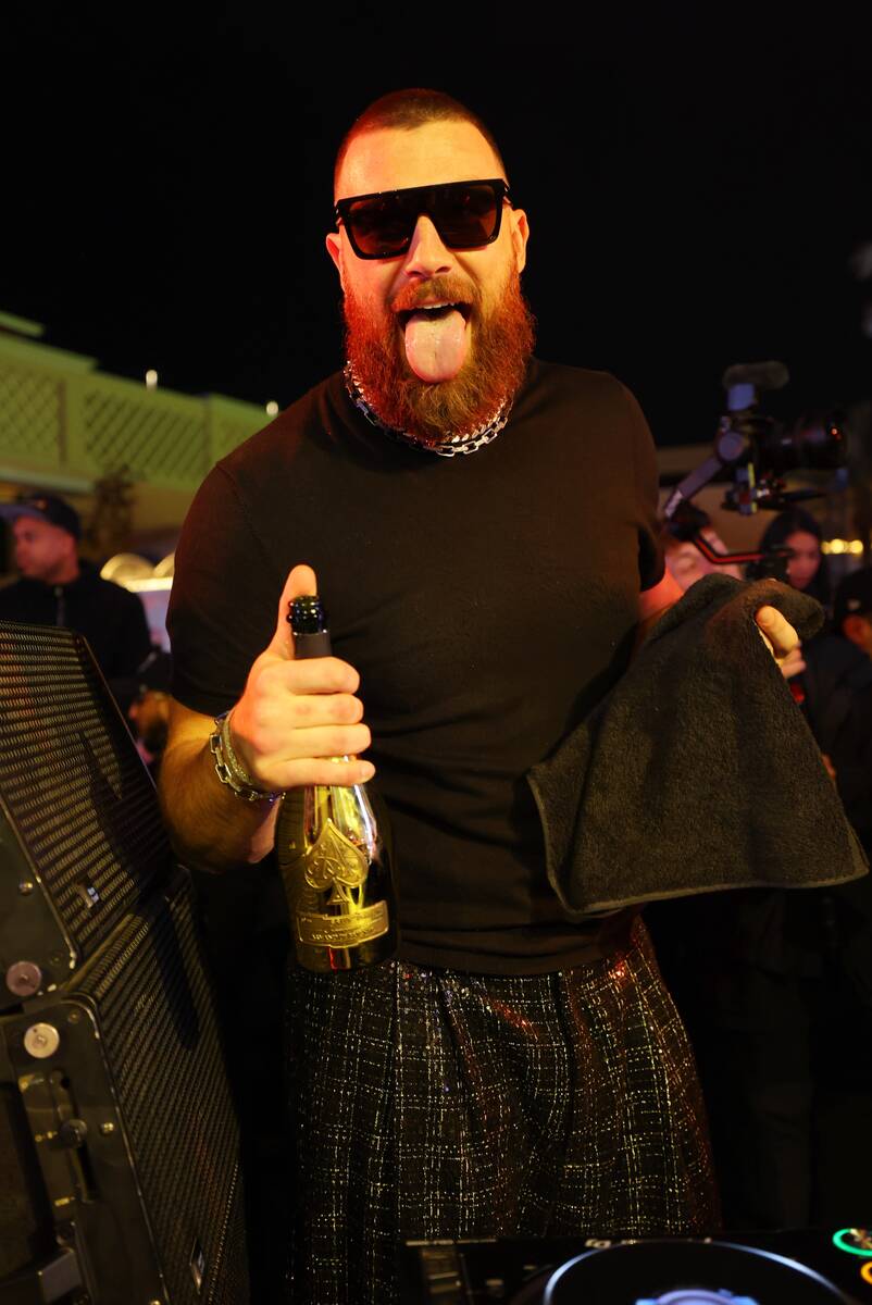 Travis Kelce pops bottles after big game win at XS Nightclub inside Wynn Las Vegas on Feb. 11, ...