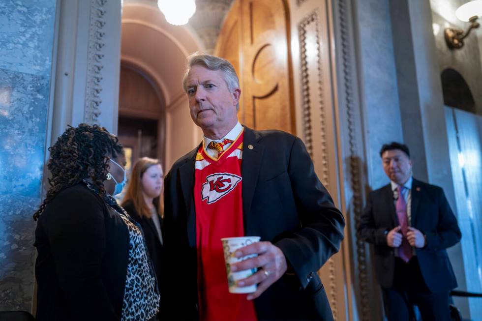 Sen. Roger Marshall, R-Kan., arrives as the Senate prepares a procedural vote on an emergency s ...