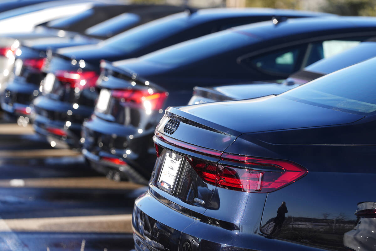 FILE - Unsold 2023 sedans sit in a long row at an Audi dealership Sunday, Feb. 11, 2024, in Bro ...