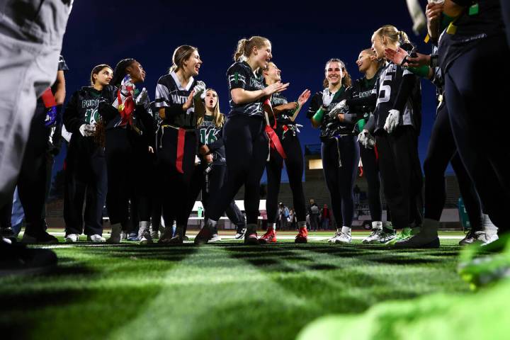Palo Verde cheers for Olivia Perkins, center right, after she helped the team win a Class 5A st ...